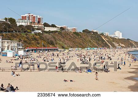 Picture - View From Bournemouth Pier Of Sunbathers At Bournemouth Beach; Bournemouth, Dorset, England, Uk. Fotosearch