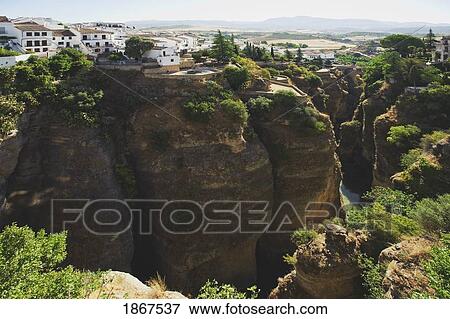 View From Puente Nuevo Bridge Across El Tajo Gorge Above River Guadalevin; Ronda, Spain View Large Photo Image Stock Photo - View From Puente Nuevo Bridge Across El Tajo Gorge Above River Guadalevin; Ronda, Spain. Fotosearch