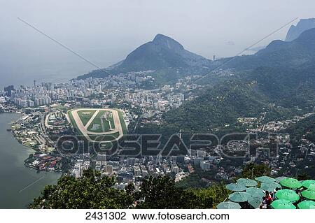 Stock Image - View from the statue of Christ the Redeemer on Corcovado Mountain over western and city Jockey Club to Leblon; Rio de Janeiro, Brazil. Fotosearch