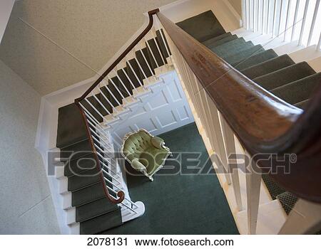 Stock Image - View From The Top Of A Staircase Down To The Lower Level In A House. Fotosearch