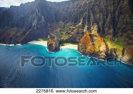 View of a beach along the coast of an hawaiian island; Na Pali coast of Kauai, Hawaii, United States of America View Large Photo Image Stock Photograph - View of a beach along the coast of an hawaiian island; Na Pali coast of Kauai, Hawaii, United States of America. Fotosearch