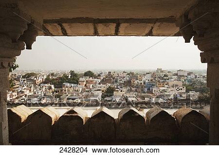 View of a city through a window with a hazy sky; Udaipur, India View Large Photo Image Picture - View of a city through a window with a hazy sky; Udaipur, India. Fotosearch