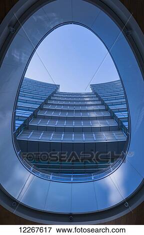 Stock Photo - View of a skyscraper through a window; Milan, Lombardy, Italy. Fotosearch