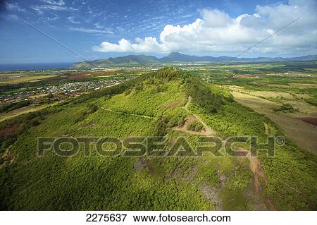 View of an urban area and landscape on an hawaiian island; Na Pali coast of Kauai, Hawaii, United States of America View Large Photo Image Stock Photo - View of an urban area and landscape on an hawaiian island; Na Pali coast of Kauai, Hawaii, United States of America. Fotosearch