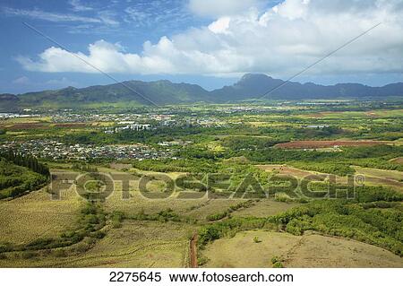View of an urban area and landscape on an hawaiian island; Na Pali coast of Kauai, Hawaii, United States of America View Large Photo Image Stock Photography - View of an urban area and landscape on an hawaiian island; Na Pali coast of Kauai, Hawaii, United States of America. Fotosearch