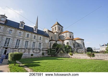 Stock Image - View Of Apse, Radiating Chapels And Crossing Tower Of The Abbey Church Of Saint-Savin Sur Gartempe From The Southeast, Saint-Savin Sur Gartempe, Vienne, France. Fotosearch
