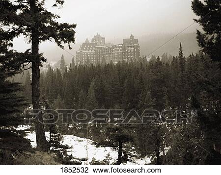 View Of Banff Hotel Through Woods, Banff, Alberta, Canada View Large Photo Image Stock Image - View Of Banff Hotel Through Woods, Banff, Alberta, Canada. Fotosearch