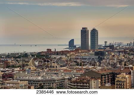 Stock Photograph - View of Barcelona at sunrise; Barcelona, Catalonia, Spain. Fotosearch