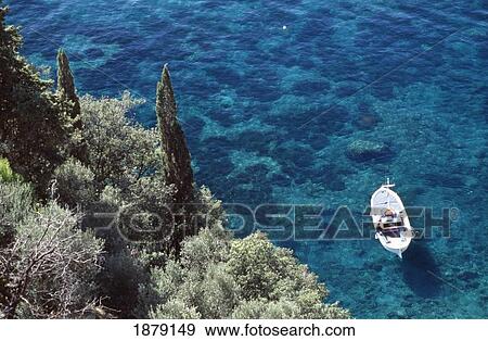 View Of Boat In Water Off Coastline, Aerial View View Large Photo Image Stock Photo - View Of Boat In Water Off Coastline, Aerial View. Fotosearch