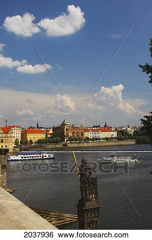 Stock Photograph - View Of Boats On The Vltava River From Charles Bridge Or Karluv Most; Prague Czech Republic. Fotosearch