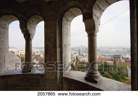 Stock Photography - View Of Budapest, As Seen Through The Arches Of The Halaszbastya Or Fisherman's Bastion, Budapest, Hungary. Fotosearch