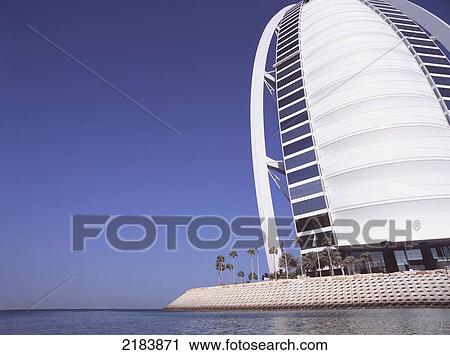 View Of Building By Sea - Burj Al Arab, Dubai Chris Caldicott / Axiom View Large Photo Image Stock Image - View Of Building By Sea - Burj Al Arab, Dubai Chris Caldicott / Axiom. Fotosearch