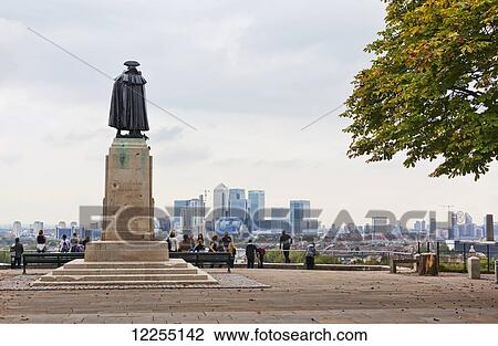 Stock Image - View of Canary Wharf from the General Wolfe lookout in Greenwich Park; London, England. Fotosearch