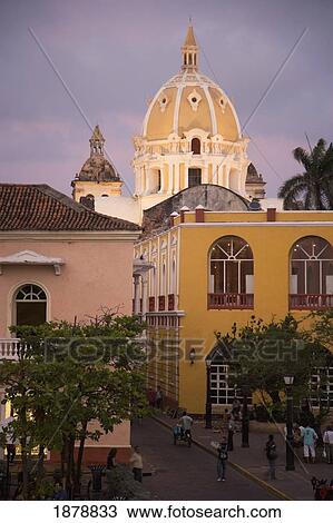 Stock Image - View Of Cartagena After Sunset With Dome Of San Pedro Claver In Background. Fotosearch