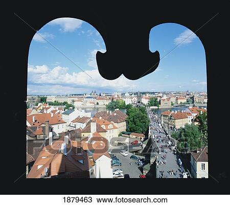 Stock Image - View Of Charles Bridge Through Windows, High Angle View. Fotosearch