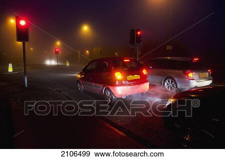Stock Photo - View of city traffic on foggy night; United Kingdom. Fotosearch