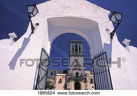 Picture - View Of Clock Tower Through Whitewashed Gate. Fotosearch