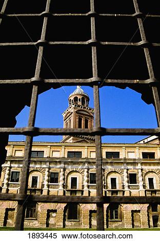 Stock Photography - View Of Cortile Della Cavallerizza Through Iron Bars. Fotosearch