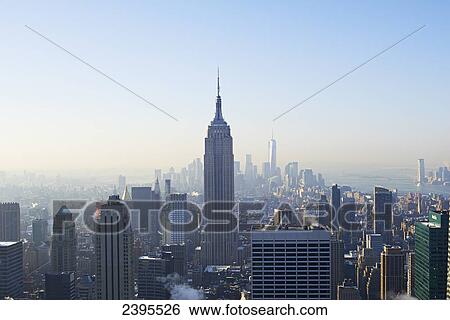 Stock Photograph - View of Empire State Building and financial district from Top of the Rock at Rockefeller Centre; New York City, New York, United States of America. Fotosearch