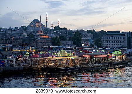 Stock Image - View Of Fish Boats And Rustem Pasa Mosque; Istanbul, Turkey. Fotosearch