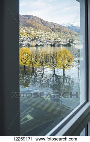 View of flooded Lake Maggiore out a window; Locarno, Ticino, Switzerland View Large Photo Image Stock Image - View of flooded Lake Maggiore out a window; Locarno, Ticino, Switzerland. Fotosearch