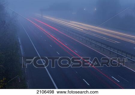 View of highway on foggy morning; United Kingdom View Large Photo Image Stock Photo - View of highway on foggy morning; United Kingdom. Fotosearch