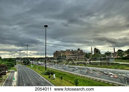 Stock Image - View Of Lake Shore Blvd. W And The Gardiner Expressway With St. Joseph's Hospital In The Background, Toronto, Ontario. Fotosearch