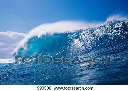 View Of Large, Glassy Wave, With Blue Sky In Background View Large Photo Image Stock Photo - View Of Large, Glassy Wave, With Blue Sky In Background. Fotosearch