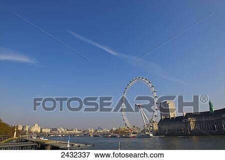 Stock Photo - View of London Eye and South bank from Westminster bridge; London, England. Fotosearch