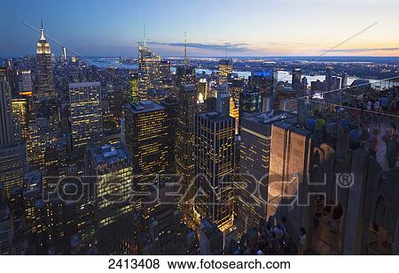 Stock Photo - View of Midtown Manhattan from the Top of the Rock Observation Tower at the Rockefeller Center at sunset; New York City, New York, United States of America. Fotosearch