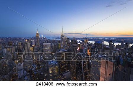 View of Midtown Manhattan from the Top of the Rock Observation Tower at the Rockefeller Center at sunset; New York City, New York, United States of America View Large Photo Image Stock Photograph - View of Midtown Manhattan from the Top of the Rock Observation Tower at the Rockefeller Center at sunset; New York City, New York, United States of America. Fotosearch