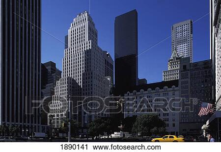 Stock Image - View Of Midtown's Skyline With Yellow Taxi. Fotosearch