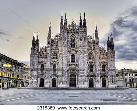 Stock Image - View of Milan Cathedral in Piazza del Duomo at sunrise; Milan, Italy. Fotosearch