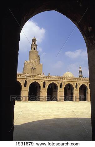 Stock Photo - View Of Minaret And Courtyard Of Ibn Tulun Mosque Through An Arch, Cairo, Egypt; Cairo, Egypt. Fotosearch
