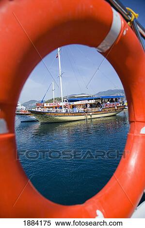 Stock Photography - View Of Moored Boats Through The Life Ring From Another Boat. Fotosearch