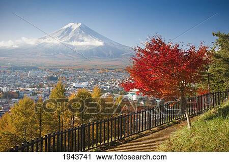 Stock Image - View Of Mount Fuji And Fujiyoshida City From A Park; Fujiyoshida Honshu Japan. Fotosearch