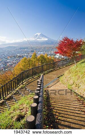 Stock Image - View Of Mount Fuji And Fujiyoshida City From A Park; Fujiyoshida Honshu Japan. Fotosearch