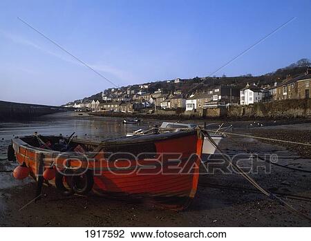 Stock Image - View Of Mousehole Harbor At Low-Tide. Fotosearch