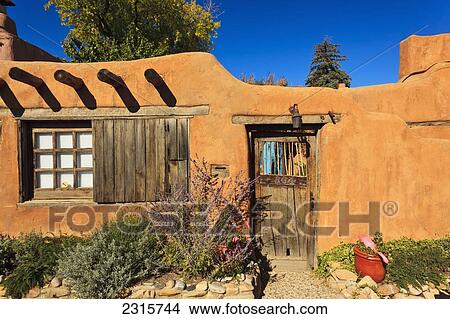 Picture - View of old wooden door in wall off Canyon Road; Santa Fe, New Mexico, USA. Fotosearch