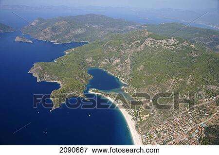 View Of Oludeniz Which Is Considered A Mecca For Paragliding At Turquoise Coast, Southern Turkey View Large Photo Image Stock Photo - View Of Oludeniz Which Is Considered A Mecca For Paragliding At Turquoise Coast, Southern Turkey. Fotosearch