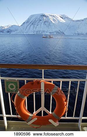 Stock Photograph - View Of Snowcapped Mountains From Ship. Fotosearch