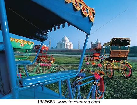 View Of Taj Mahal As Seen Through Colorful Rickshaws View Large Photo Image Stock Photo - View Of Taj Mahal As Seen Through Colorful Rickshaws. Fotosearch
