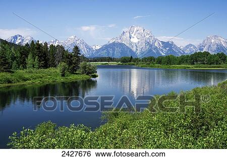 Stock Photograph - View of Teton Mountain range and Mt. Moran from Oxbow Bend turnout on park road; Wyoming, United States of America. Fotosearch