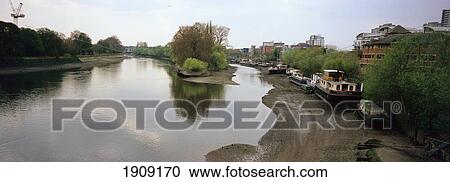 Stock Image - View Of Thames Looking Westwards, From Kew Bridge, Kew, West London, England, Uk. Fotosearch