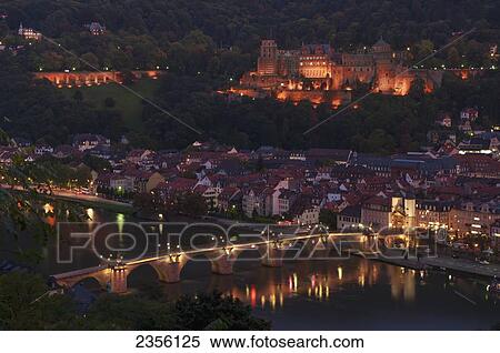 View of the city of Heidelberg at nighttime and a bridge crossing the River Neckar; Heidelberg, Baden-Wurttemberg, Germany View Large Photo Image Stock Photography - View of the city of Heidelberg at nighttime and a bridge crossing the River Neckar; Heidelberg, Baden-Wurttemberg, Germany. Fotosearch