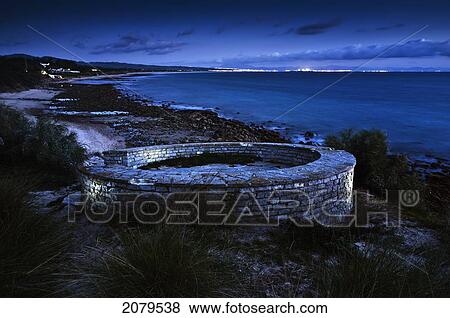 Stock Photo - View Of The Coastline At Dusk; Tarifa Cadiz Andalusia Spain. Fotosearch