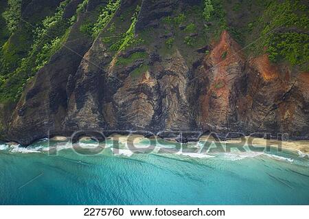 Stock Image - View of the coastline of an hawaiian island; Na Pali coast of Kauai, Hawaii, United States of America. Fotosearch