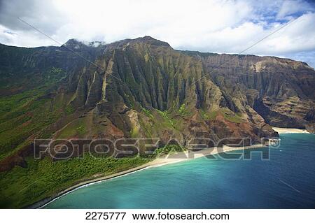 Stock Photo - View of the coastline of an hawaiian island; Na Pali coast of Kauai, Hawaii, United States of America. Fotosearch