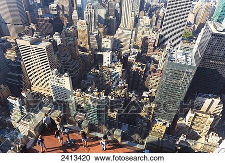 Stock Image - View of the Empire State Building and Manhattan from the Top of the Rock Observation Tower at the Rockefeller Center; New York City, New York, United States of America. Fotosearch