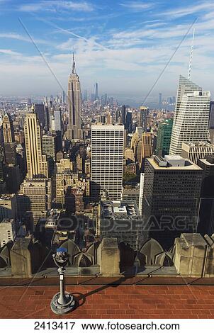 View of the Empire State Building and Manhattan from the Top of the Rock Observation Tower at the Rockefeller Center; New York City, New York, United States of America View Large Photo Image Stock Photo - View of the Empire State Building and Manhattan from the Top of the Rock Observation Tower at the Rockefeller Center; New York City, New York, United States of America. Fotosearch